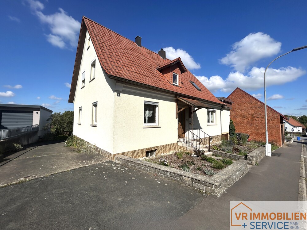 Mehr als nur vier Wände! - Einfamilienhaus mit Nebengebäude, Doppelgarage & Garten in 97618 Wollbach!