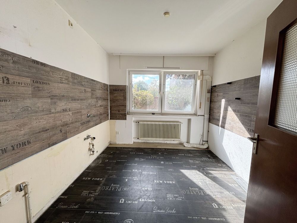 Renovierungsbedürftige Eigentumswohnung mit Garage im Hochpaterre: Ihr neues Zuhause in Ahlen erwartet Sie!