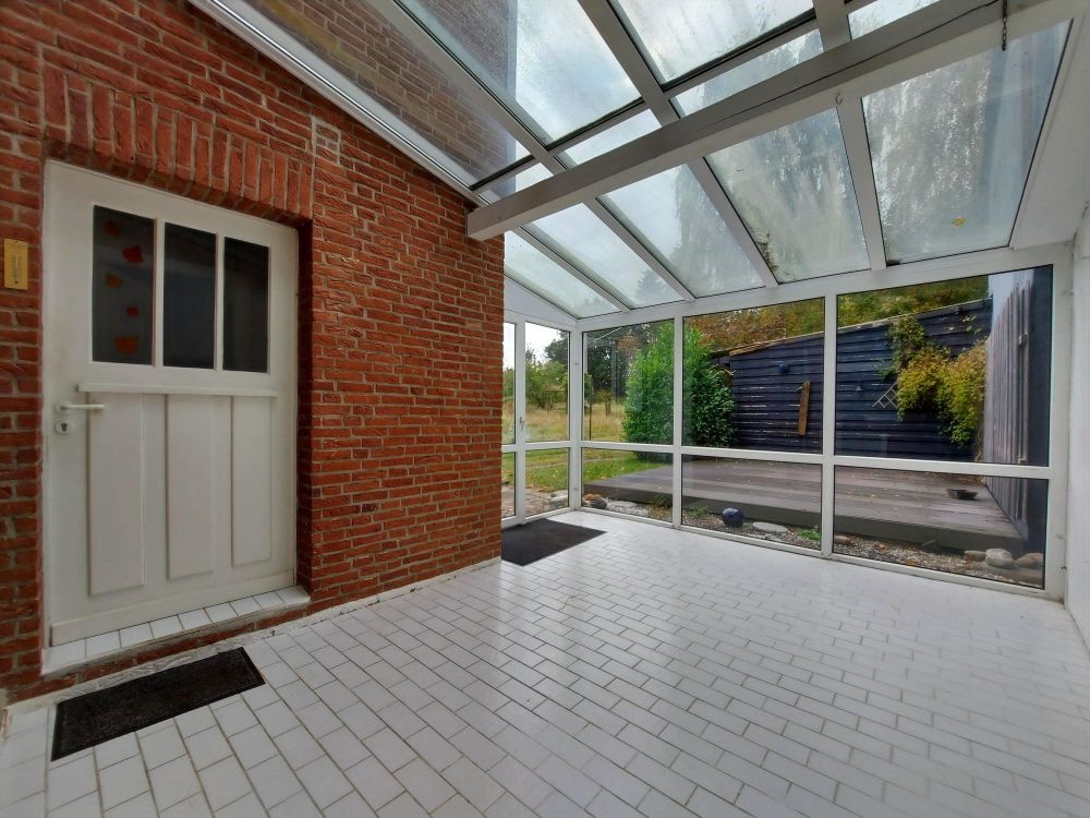 Ein Zuhause mit Potenzial – gemütliche Doppelhaushälfte mit Wintergarten, Carport und Gewächshaus