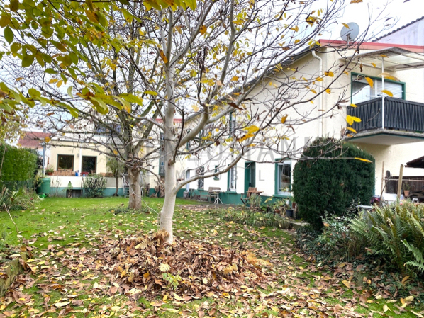 Mehrfamilienhaus mit Gewerbeeinheit (teilvermietet) und großem Garten