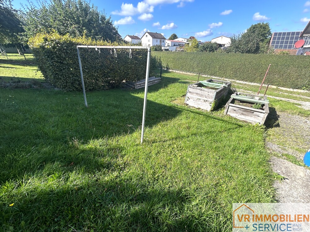 Mehr als nur vier Wände! - Einfamilienhaus mit Nebengebäude, Doppelgarage & Garten in 97618 Wollbach!