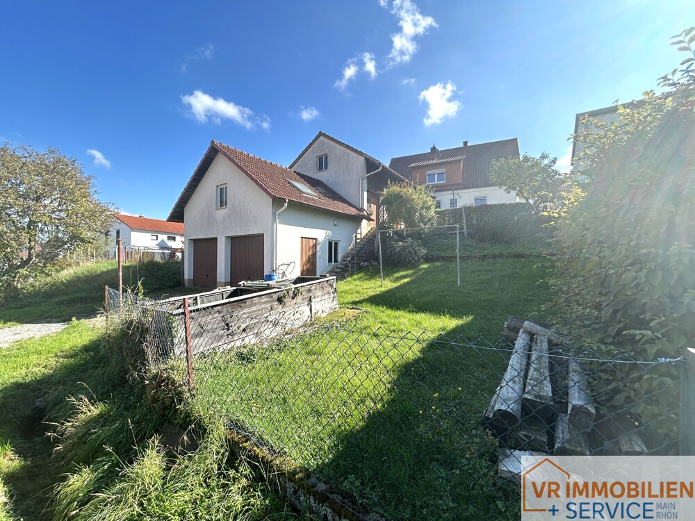 Mehr als nur vier Wände! - Einfamilienhaus mit Nebengebäude, Doppelgarage & Garten in 97618 Wollbach!