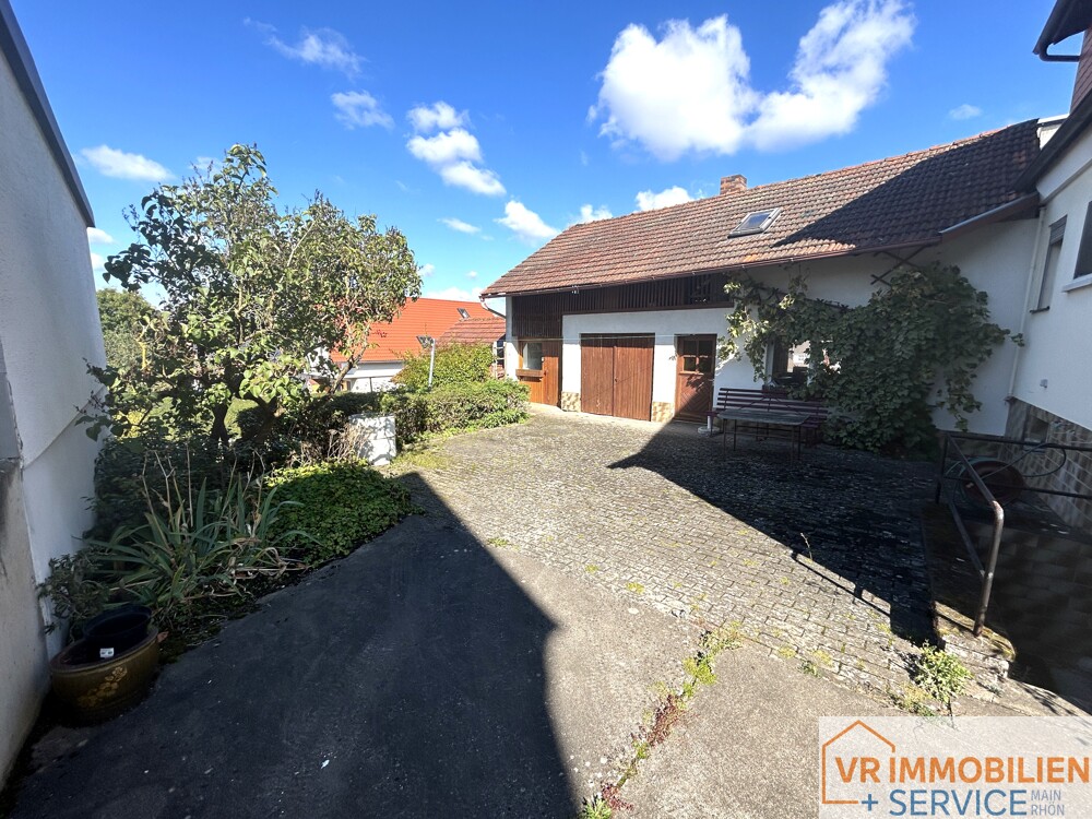 Mehr als nur vier Wände! - Einfamilienhaus mit Nebengebäude, Doppelgarage & Garten in 97618 Wollbach!