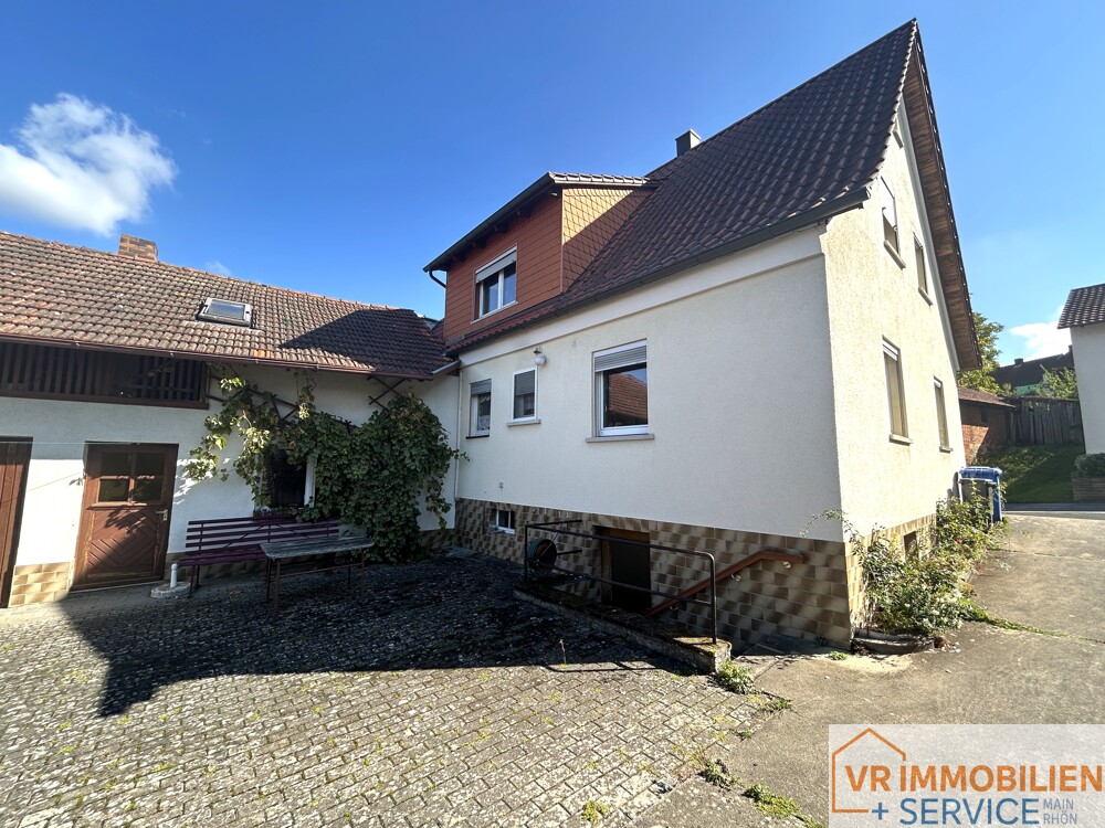 Mehr als nur vier Wände! - Einfamilienhaus mit Nebengebäude, Doppelgarage & Garten in 97618 Wollbach!