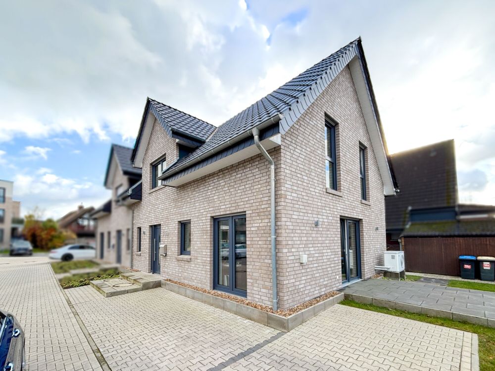 Optimal konzipiert! - Vermietete Neubau-Doppelhaushälfte im Ortskern von Bevergern!